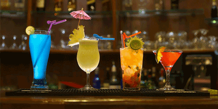four glasses on bar