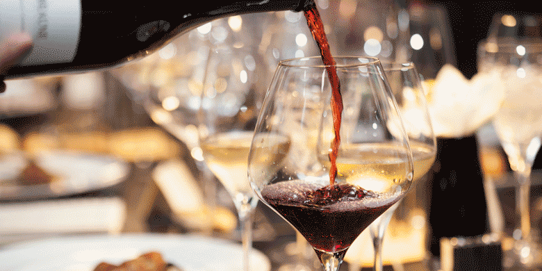 wine poured into a wine glass wine poured into a wine glass