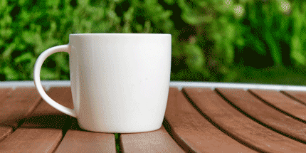 ceramic white mug on table