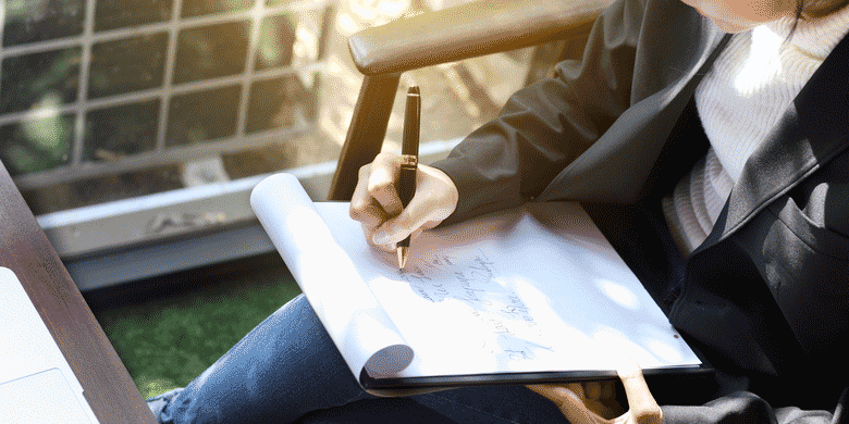 woman using pen woman using pen