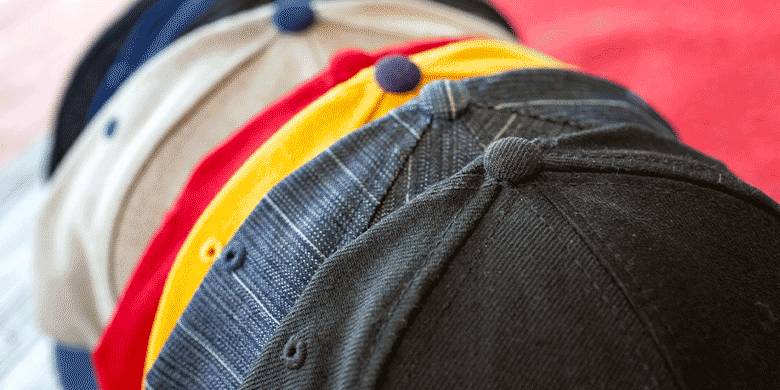 collection of baseball caps