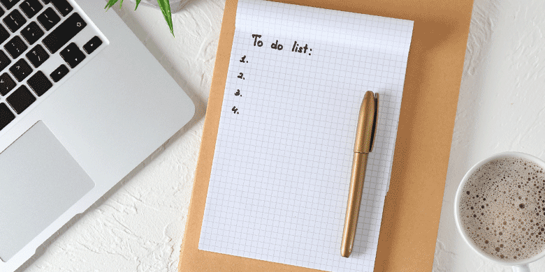 a to do list with gold pen a to do list with gold pen