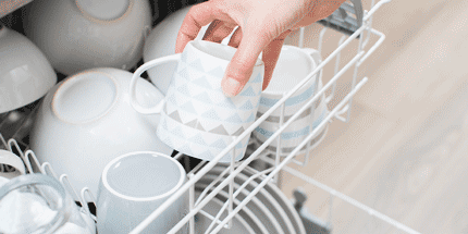 loading dishwasher with mugs