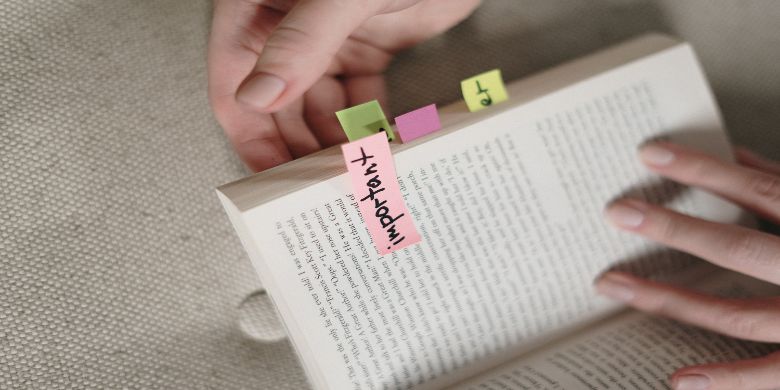 An open book with some bookmark tabs which read the word "important!"
