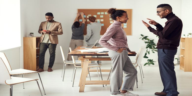 People discussing project ideas in a workspace.