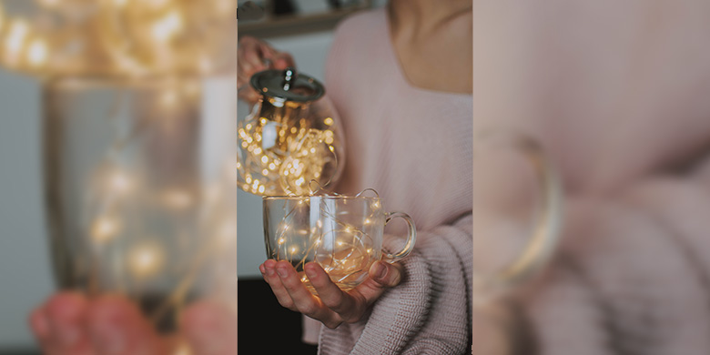 Tea lights glowing within some glassware