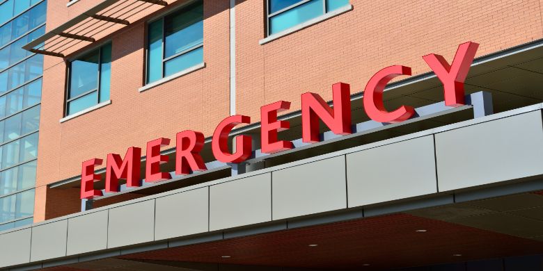 The emergency sign on a hospital building.