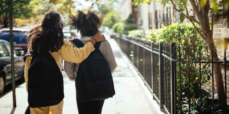 kids walking to school with backpacks