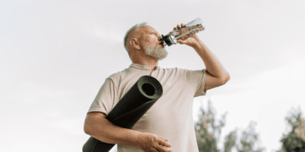 yoga man drinking water