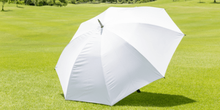 white umbrella on golf course
