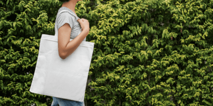 woman holding tote bag