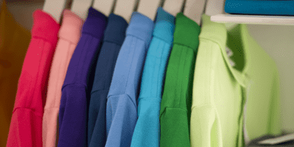 rack of colourful polo shirts