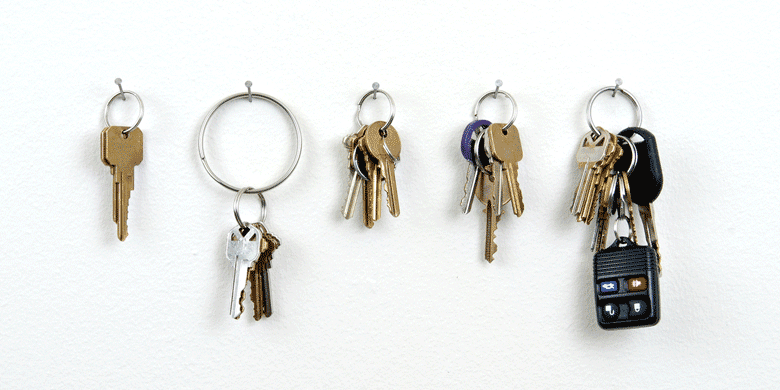 five keys hanging on the wall