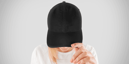 woman wearing black cap