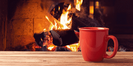 red mug near fireplace