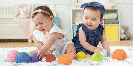 babies with stress balls