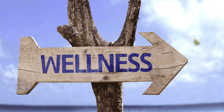 wellness sign on tree