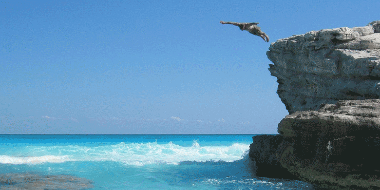 man cliff diving