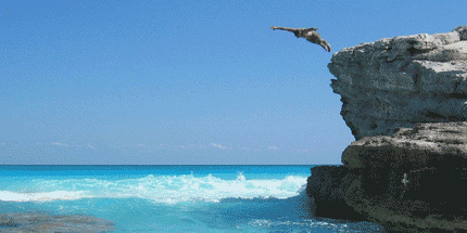 man cliff diving