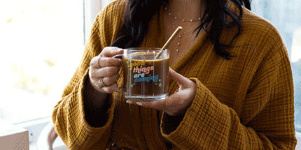 woman drinking glass mugs